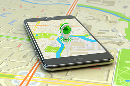 Smartphone with city map application and marker pin pointer on phone screen